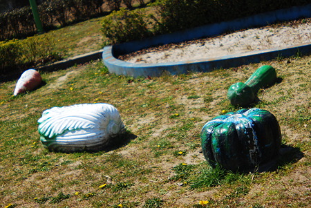 Giant vegetables scattered around the park.